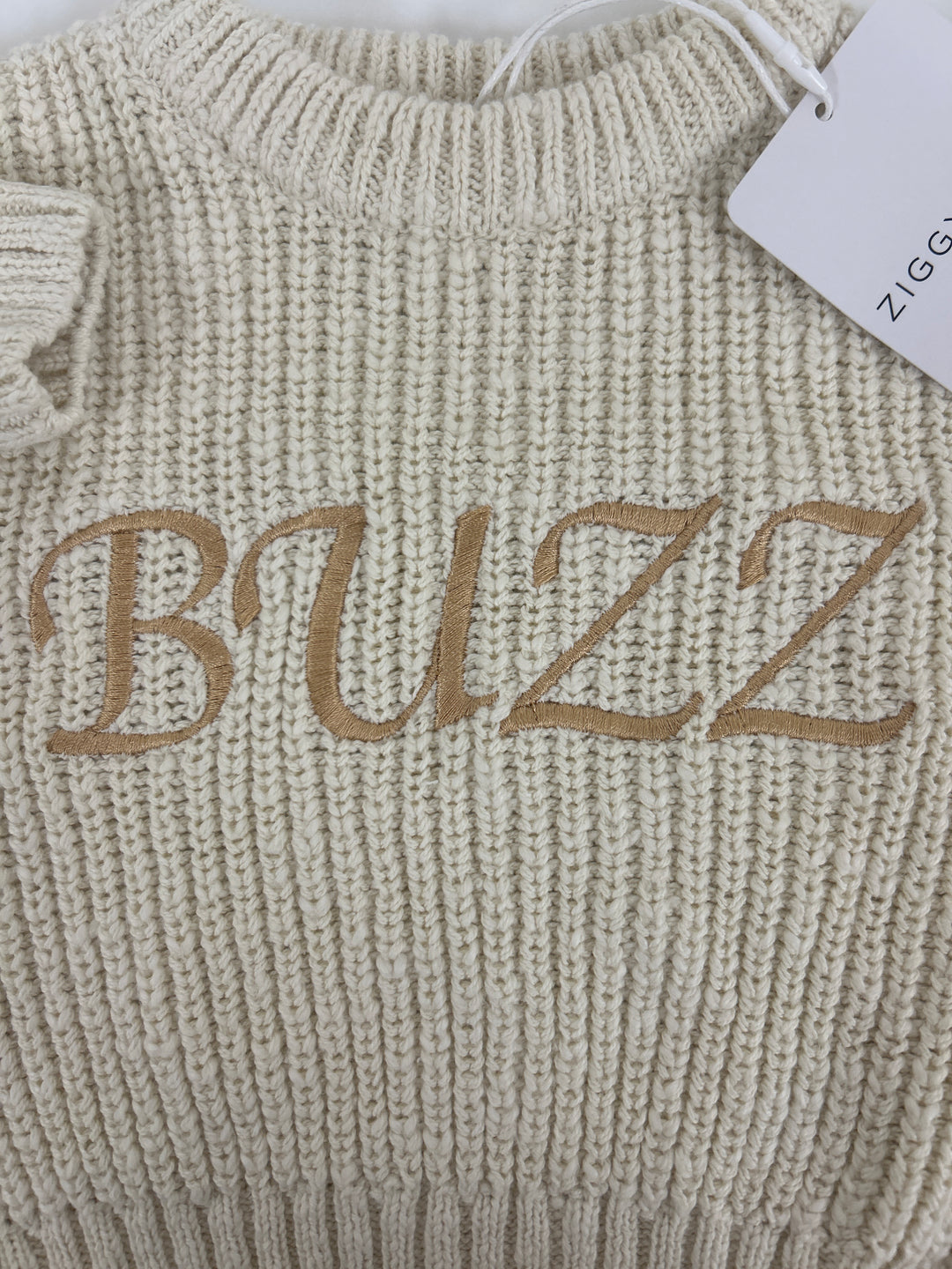 3. Honey jumper 0-3m, embroidered “BUZZ” in a golden font.One-off sample stock