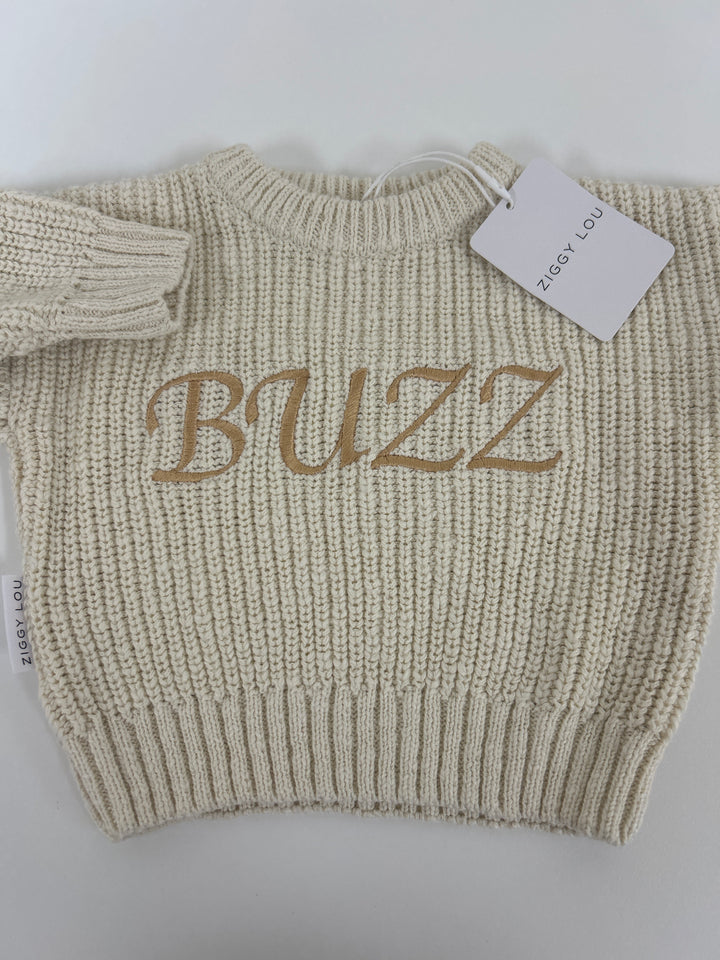 3. Honey jumper 0-3m, embroidered “BUZZ” in a golden font.One-off sample stock