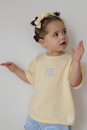 SIGNATURE TEE BUTTERCUP